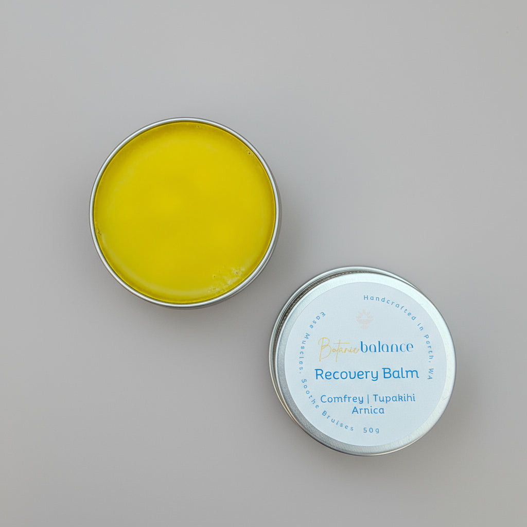 Open tin of Recovery balm for muscle recovery, sprains, bruises, arnica, comfrey, tupakihi