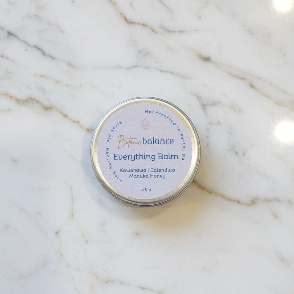 Tin of 'Everything Balm' on a marble surface